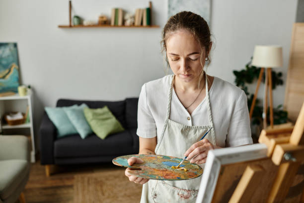 istock A talented artist with vitiligo creates vibrant art in her cozy home studio 2168763078