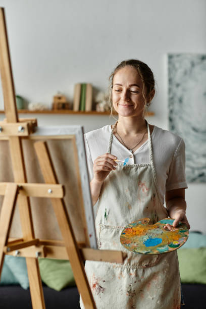 istock A creative moment at home with a talented woman expressing herself through painting 2168763082
