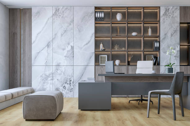 istock Front view of a modern home office with minimalistic design with a desk, decoration, ergonomic chair, soft bench and windows 2168765100