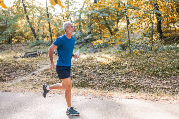 istock Active Senior Man Running in the Park 2168765594