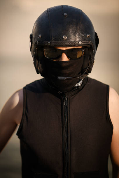 istock Biker in Full Gear with Helmet and Goggles 2168766075