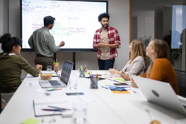 istock Businessman giving presentation in conference room 2168769624