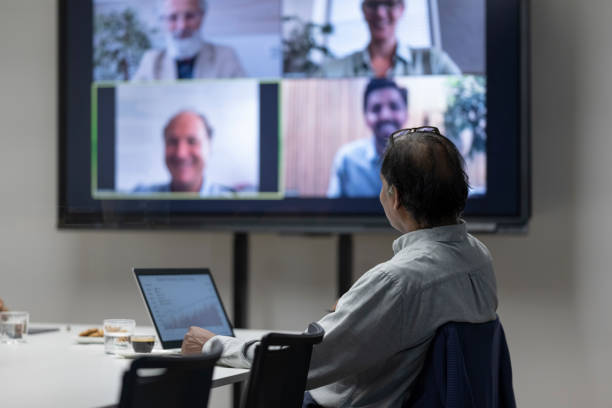 Mature businessman on conference call