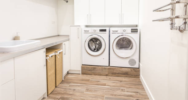 istock Laundry room with washing machine in modern house 2168774433