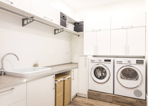 istock Laundry room with washing machine in modern house 2168774492