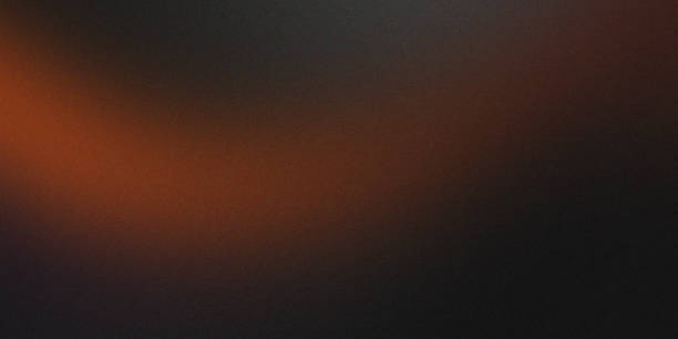 istock Black and Brown with Orange and Gold Gradient and Grainy Noise Texture 2168775914