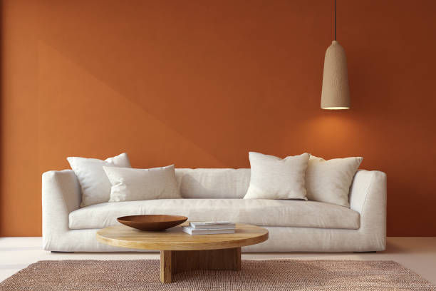Wabi-sabi living room interior. Modern couch near blank terracotta wall. Interior mockup. 3d render.
