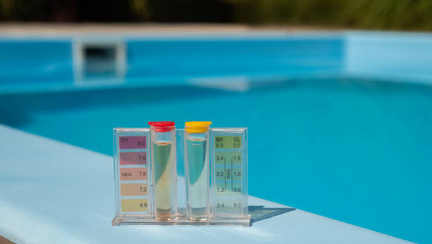 istock A pool water testing kit with pH and chlorine levels is placed on the pool's edge, with the blue pool water providing a clear backdrop. 2168778655