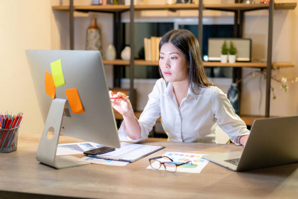 istock A woman working late at home 2168781093
