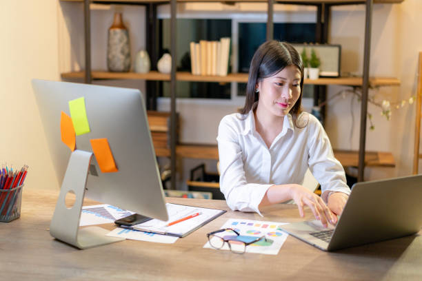istock A woman working late at home 2168781095