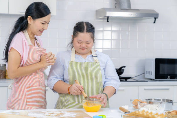istock Mother and daughter enjoy baking together in the kitchen 2168781128