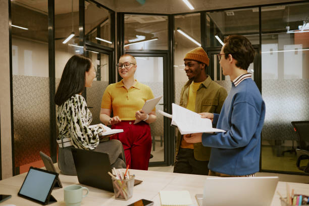 istock Group of Diverse Young Business People Discussing Project 2168785462
