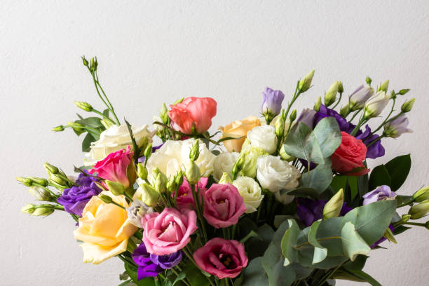 istock Celebrate special occasions with a colorful summer bouquet featuring fresh roses, eucalyptus, and eustoma blooms, creating an elegant and fragrant floral arrangement 2168789833