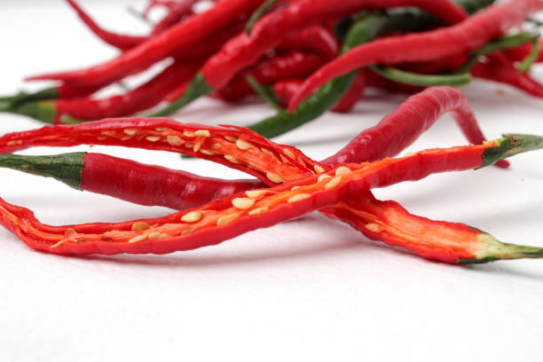 Fresh red big chili with green stem, isolated on white background