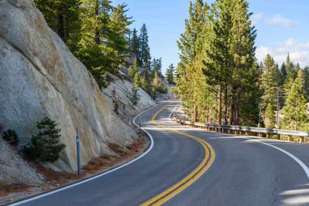 Deserted winding mountain road on a clear autumn day