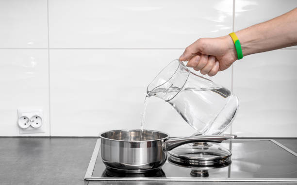 istock Filling the pot with cold water for cooking, clean drinking water 2168794852