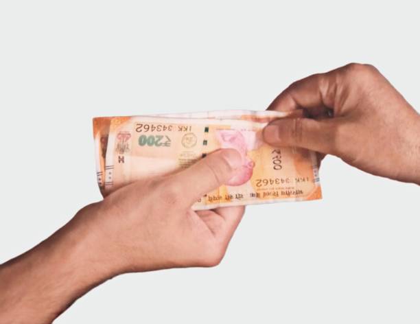 istock Man giving Indian rupee currency with white background 2168796476