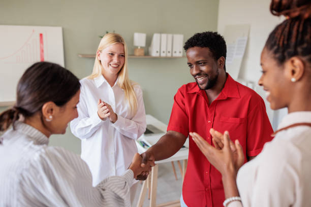 istock Business coworkers shaking hands in the office 2168798026