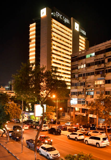 Luanda, Angola: nocturnal view of the Epic Sana Hotel and Mission Street, Ingombota. An upscale five-star property located in the heart of the capital, with modern conference facilities attracting both private and state functions. The SANA Hotels chain is a prestigious Portuguese hospitality brand known for its diverse portfolio of luxury and lifestyle hotels.