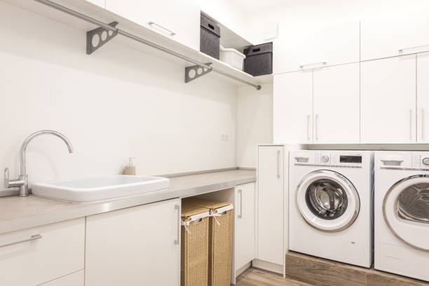 istock Laundry room with washing machine in modern house 2168800163
