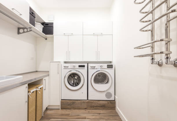 istock Laundry room with washing machine in modern house 2168800165