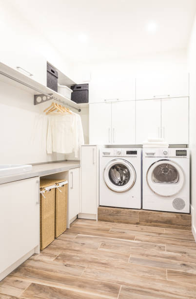 istock Laundry room with washing machine in modern house 2168800166