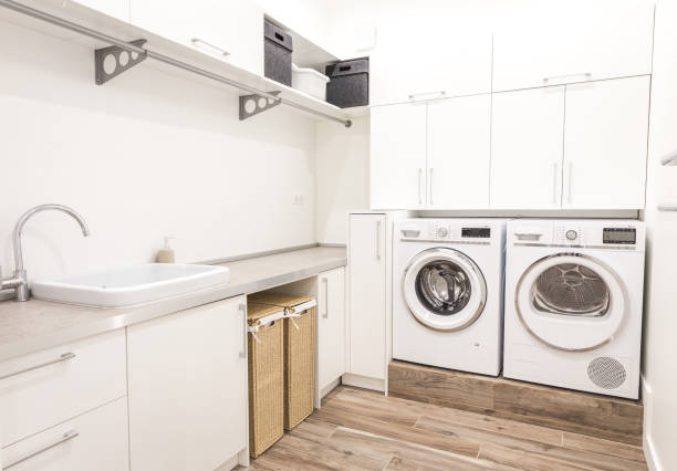 istock Laundry room with washing machine in modern house 2168800169