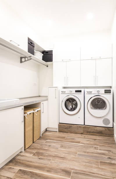 istock Laundry room with washing machine in modern house 2168800170