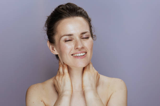 istock happy young woman on blue 2168802716