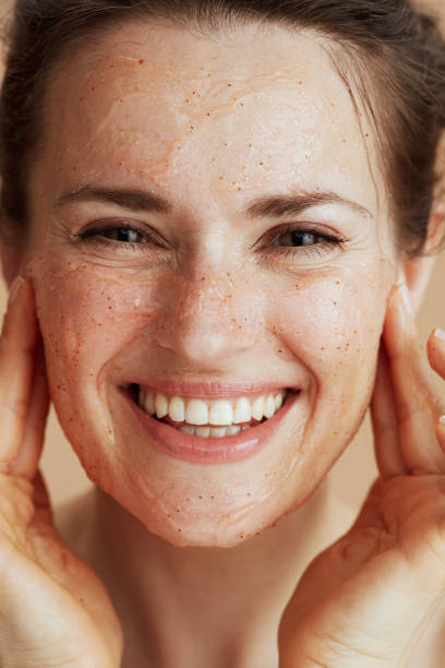 istock happy young woman with face scrub 2168802722