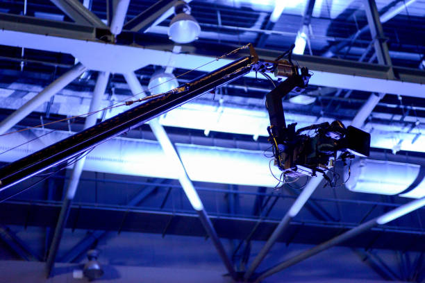 video camera recording on a crane at concert event