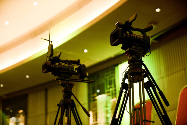 istock Two video cameras recording at event 2168804903