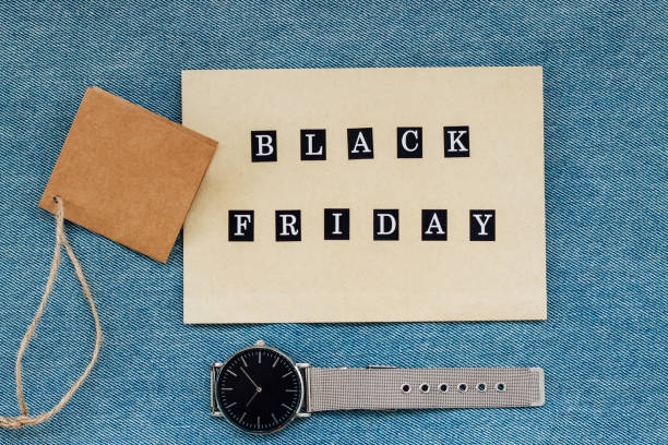 istock wristwatch with tag black friday on denim texture 2168806129