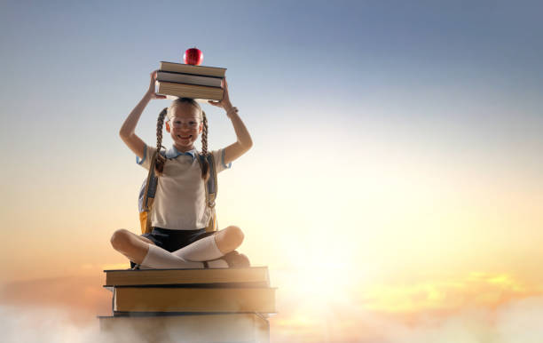 istock child on the tower of books 2168806359