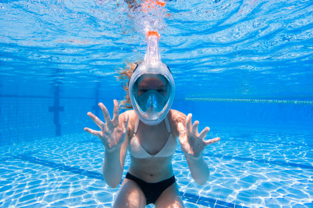 istock Girl Underwater in Swimming Pool 2168807547