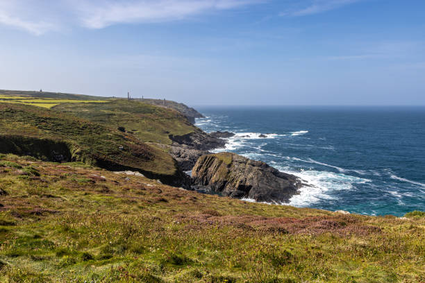 istock Looking along the Cornish coastline from near Pendeen Lighthouse, with a blue sky overhead 2168808440