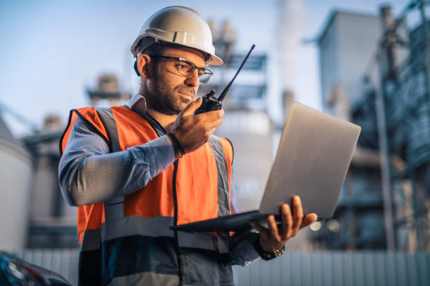 istock Serious handsome engineer using a laptop while working in the oil and gas industry 2168809182