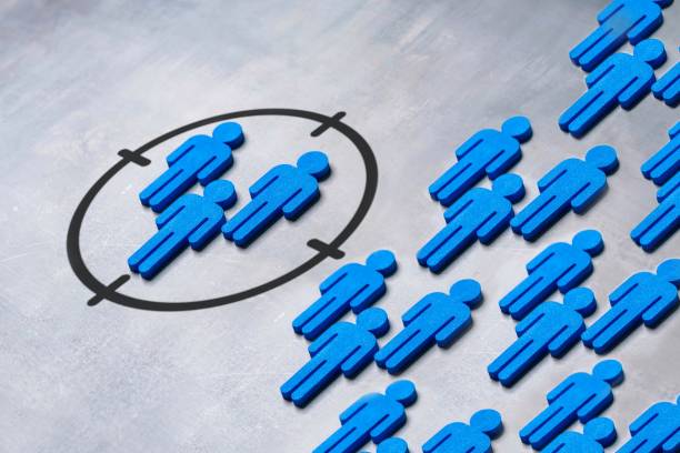 istock Group of human figures in a targeting reticle on grey background. 2168809442
