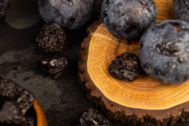 ripe purple plums and dried plums