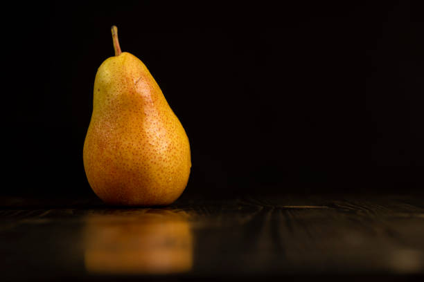 istock fresh red pear with yellow color on the table 2168809798