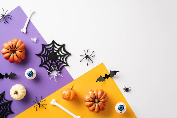 istock Creative Halloween background with decorative pumpkins, spiderwebs, and spooky elements for a festive celebration 2168812053
