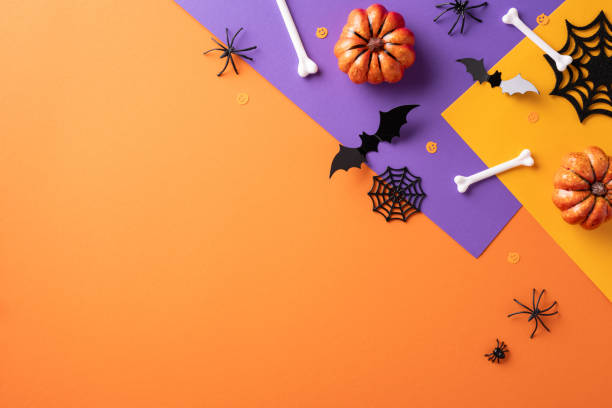 istock Stylish Halloween background featuring pumpkins, bats, bones, and spiders on an orange and purple backdrop. Perfect for seasonal advertisement and festive card designs 2168812097