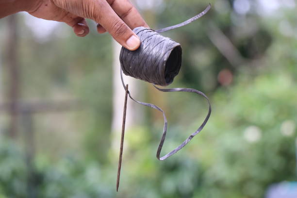istock Plastic wire and long sewing needle. Traditional equipment for patching 2168813180