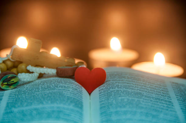 Heart space on top of a Bible with customizable space for text or religion message. Christianity and Religious concept.