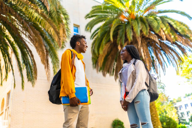 istock African american university students chatting relaxed after class 2168820391