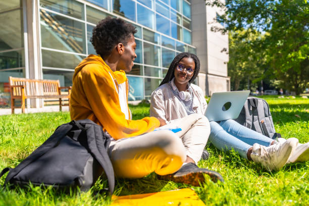 istock African colleagues studying together using laptop in the campus 2168821108