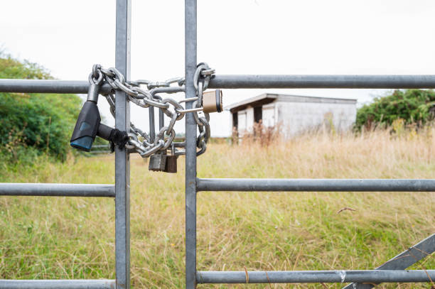 Shallow focus of a locked farm and paddock gate which has been subject to rural crime. stock photo