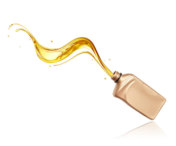 istock Splashes of engine oil pouring from a plastic bottle isolated on white background 2168822664