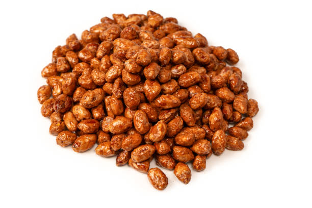 istock Tasty sweet roasted peanuts isolated on a white background. 2168829563
