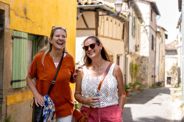 istock Friends Having Fun Whilst Walking Through Rustic French Streets 2168831722